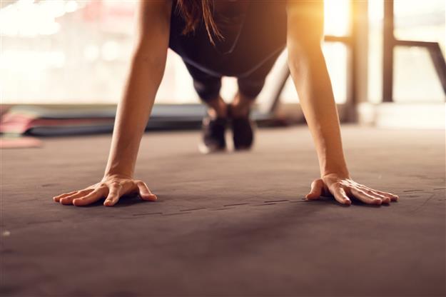 female athlete doing pushups